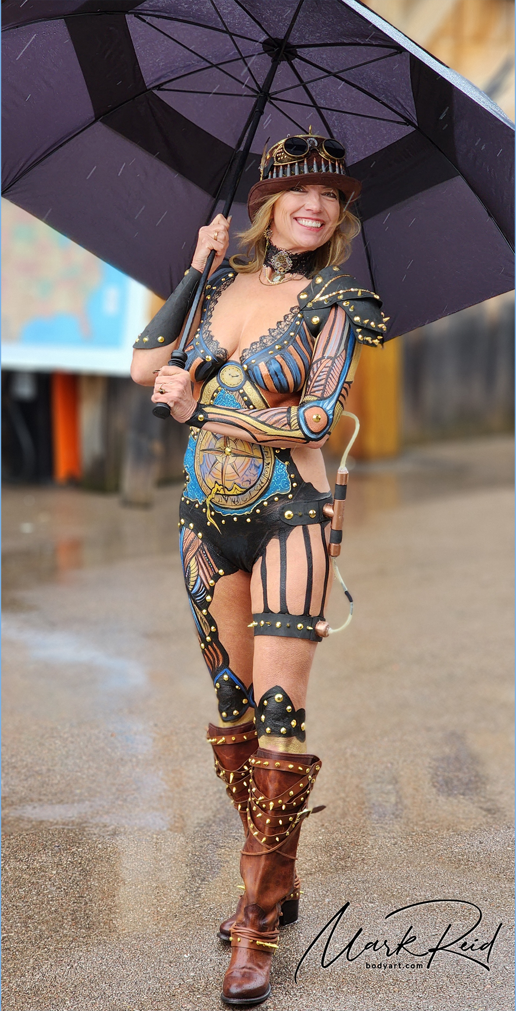 Extremely detailed steampunk themed full body painting on a gorgeous blonde model. It includes steam vents on her left hip, chest and thigh. Steampunk hat and boots as well.