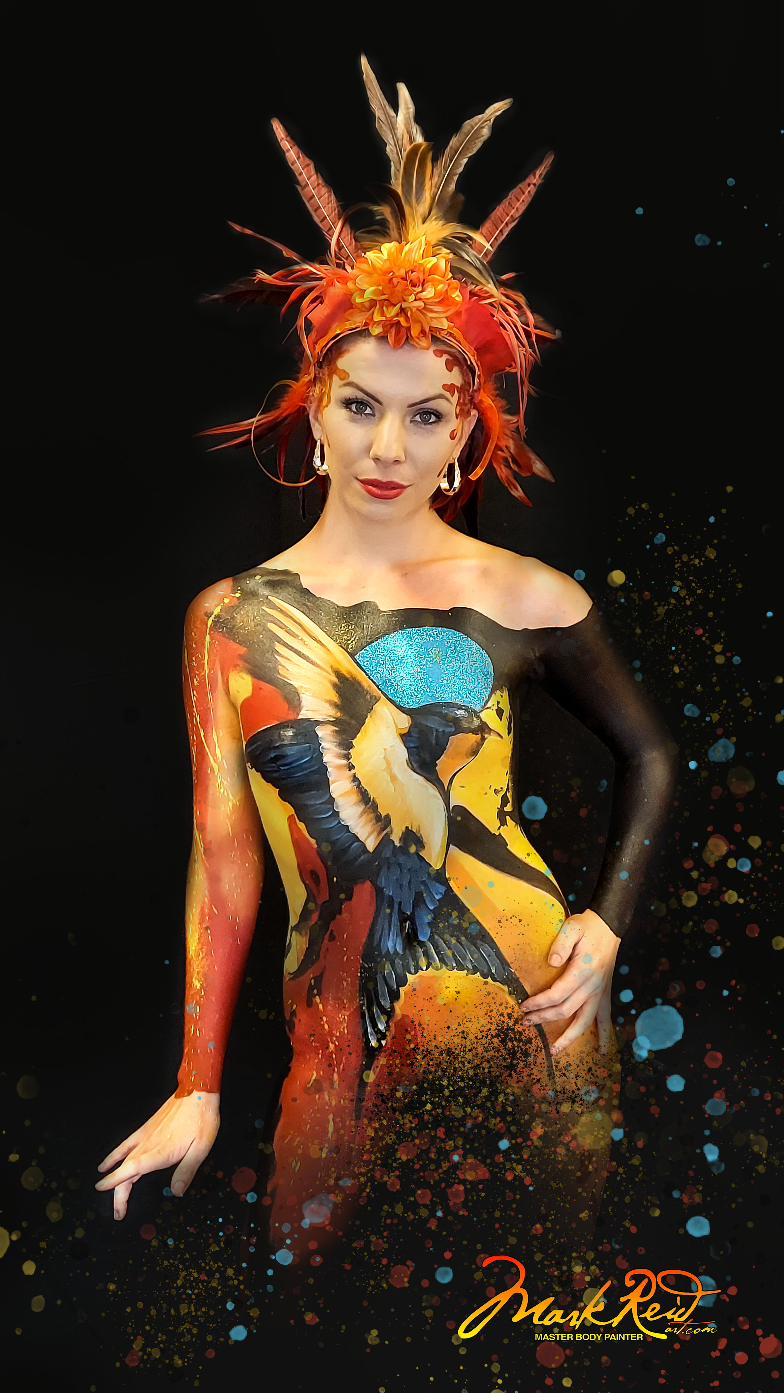 Woman in full body paint that is extremely detailed and features a side view of a flying barn swallow.  Very colorful painting and she is wearing a headdress with lots of colorful feathers.