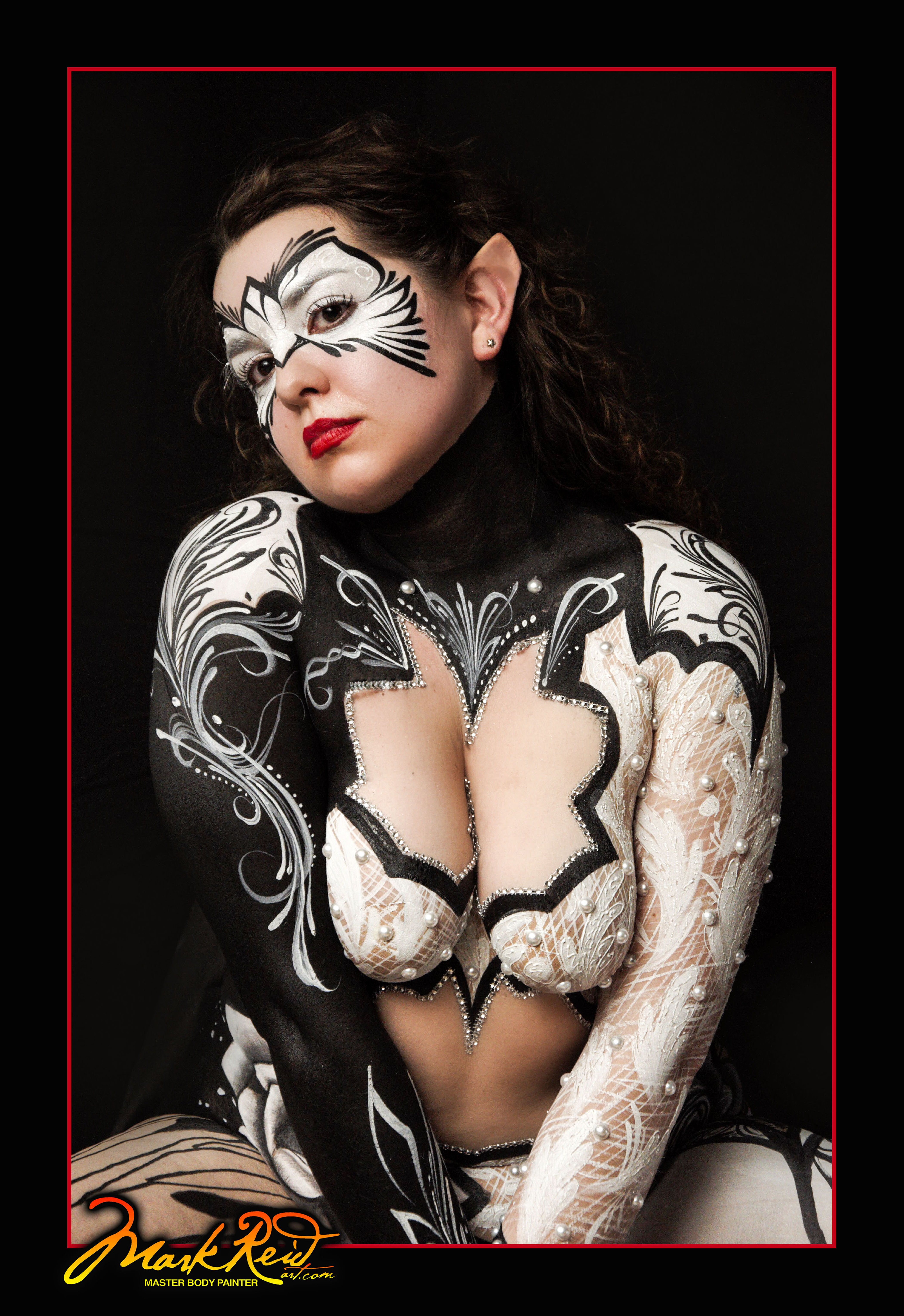 Brunette painted with silver and black body paint